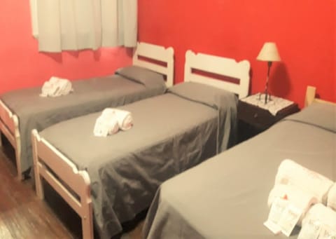 Triple Room, 1 Bedroom, Shared Bathroom | Iron/ironing board, free WiFi, bed sheets