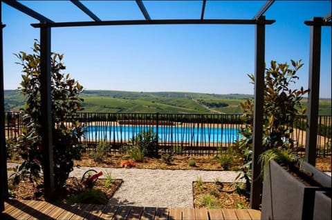 Seasonal outdoor pool, open 8:30 AM to 9 PM, pool umbrellas