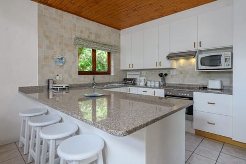 Superior Villa, 3 Bedrooms | Private kitchen | Electric kettle, dining tables