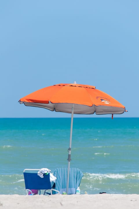 On the beach, sun loungers, beach umbrellas, beach towels