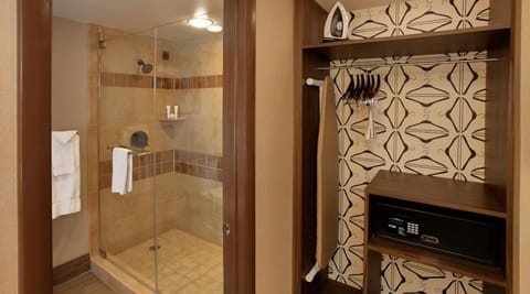 Shower, designer toiletries, hair dryer, towels