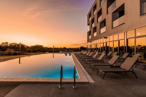 Indoor pool, outdoor pool, pool umbrellas, sun loungers