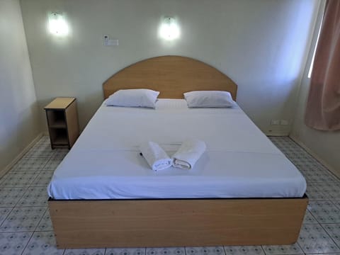 Standard Room With Air Conditioning | Desk, iron/ironing board, bed sheets