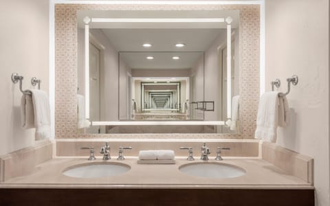 Shower, designer toiletries, hair dryer, towels