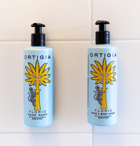 Designer toiletries, hair dryer, bathrobes, towels