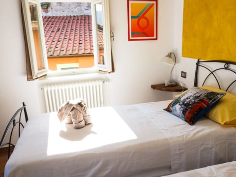 Suite, 2 Bedrooms, Balcony | Down comforters, individually decorated, iron/ironing board, free WiFi