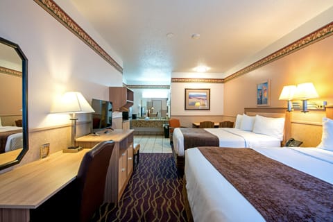 Deluxe Suite, 3 Queen Beds  | Desk, blackout drapes, iron/ironing board, free WiFi