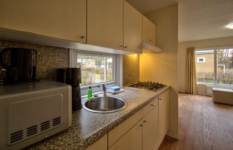 Comfort Mobile Home, 2 Bedrooms | Private kitchen | Full-size fridge, stovetop, electric kettle, highchair