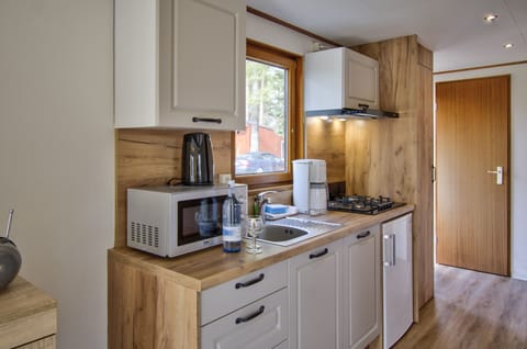 Classic Mobile Home, 2 Bedrooms | Private kitchen | Full-size fridge, stovetop, electric kettle, highchair