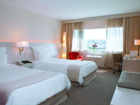 Standard Twin Room | Down comforters, minibar, in-room safe, individually decorated