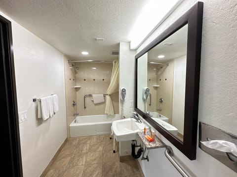 Handicap 2 queen beds w/ accessible bathtub | Bathroom | Free toiletries, hair dryer, towels