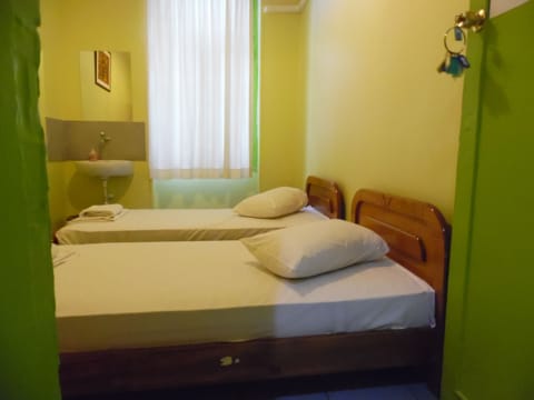 Twin Room, Shared Bathroom | Iron/ironing board, free WiFi, bed sheets