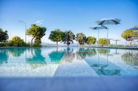 Outdoor pool, pool umbrellas, sun loungers