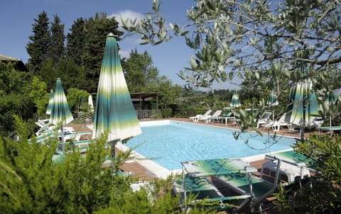 Seasonal outdoor pool, open 8:30 AM to 7:30 PM, pool umbrellas