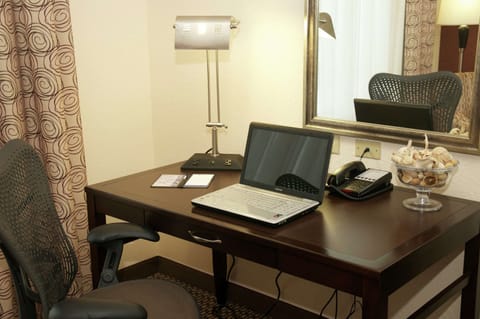 Desk, laptop workspace, blackout drapes, iron/ironing board