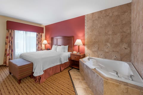 Suite, 1 King Bed, Non Smoking | Bathroom | Combined shower/tub, free toiletries, hair dryer, towels