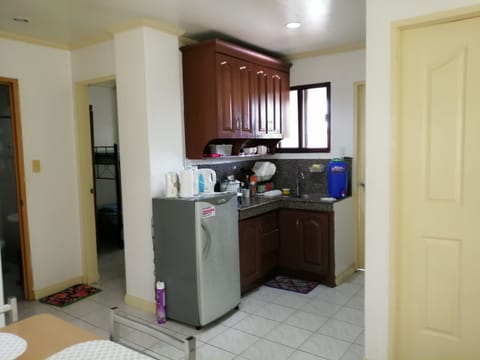 City Apartment, 2 Bedrooms | Private kitchen | Full-size fridge, stovetop, electric kettle, rice cooker