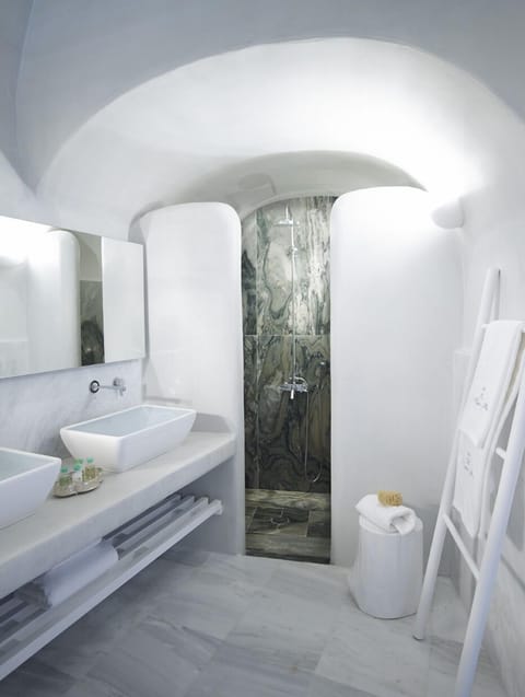 Suite (Cave) | Bathroom | Designer toiletries, hair dryer, bathrobes, slippers