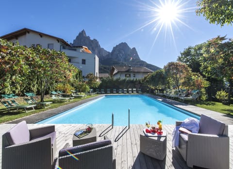 Indoor pool, seasonal outdoor pool, open 7 AM to 10:30 PM, sun loungers