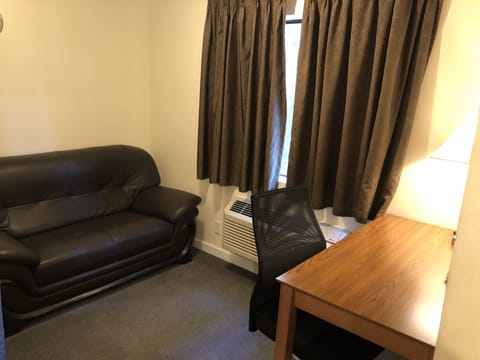 Suite, 1 King Bed | In-room safe, desk, iron/ironing board, free cribs/infant beds