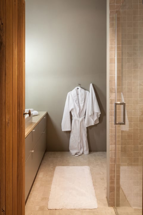 Suite, 1 King Bed | Bathroom | Shower, rainfall showerhead, free toiletries, hair dryer