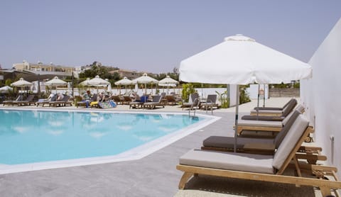 Seasonal outdoor pool, pool umbrellas, sun loungers