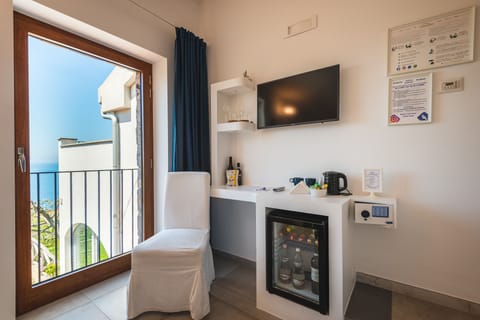 Double Room (Capri) | Minibar, in-room safe, individually decorated, desk