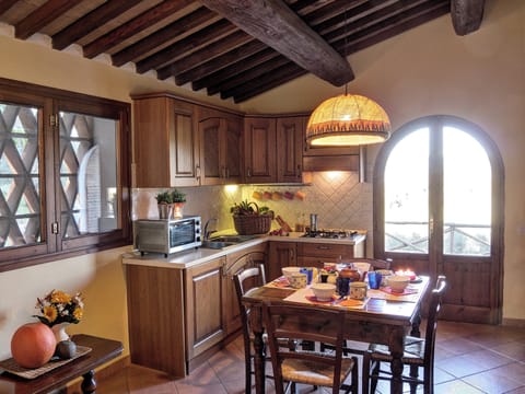 House, 2 Bedrooms, Garden View (Gli Ulivi) | Private kitchen | Fridge, stovetop, coffee/tea maker, highchair