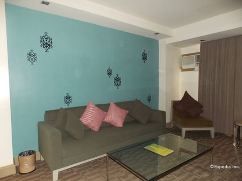 Executive Suite, 1 Bedroom | Living room | LCD TV