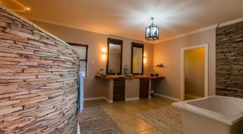 Premier Apartment | Bathroom | Deep soaking tub, hair dryer, towels