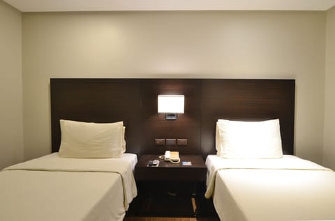 Deluxe Twin Room, 2 Twin Beds | In-room safe, individually furnished, desk, blackout drapes