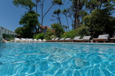 Indoor pool, seasonal outdoor pool, pool umbrellas, sun loungers