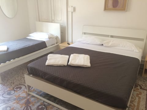Quadruple Room, Multiple Beds, Non Smoking | Desk, free WiFi, bed sheets