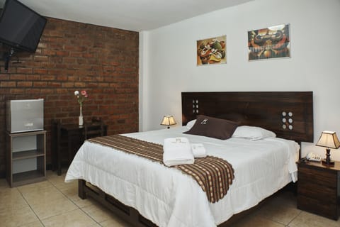 Deluxe Double Room | Down comforters, Select Comfort beds, desk, laptop workspace