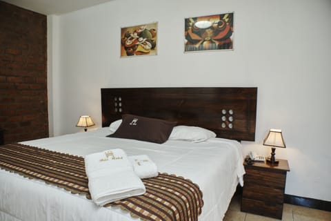 Deluxe Double Room | Down comforters, Select Comfort beds, desk, laptop workspace