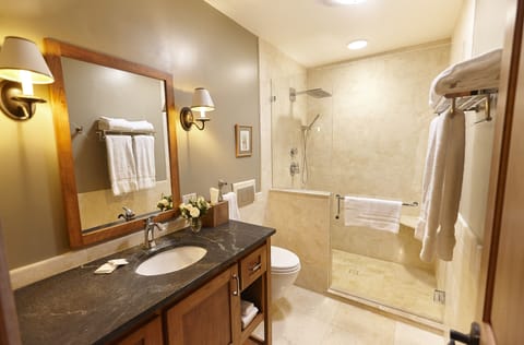 Signature Suite, 1 King Bed | Bathroom | Rainfall showerhead, designer toiletries, hair dryer, bathrobes