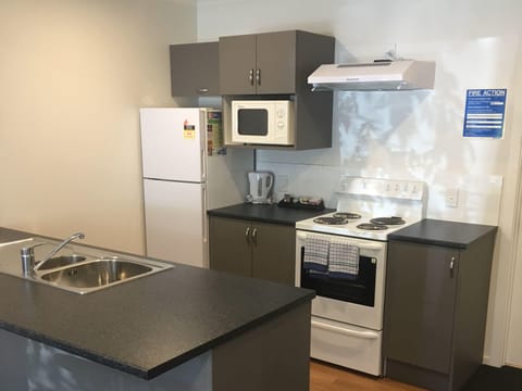 Superior One Bedroom | Private kitchen | Full-size fridge, microwave, oven, stovetop