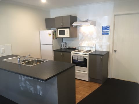 Superior One Bedroom | Private kitchen | Full-size fridge, microwave, oven, stovetop