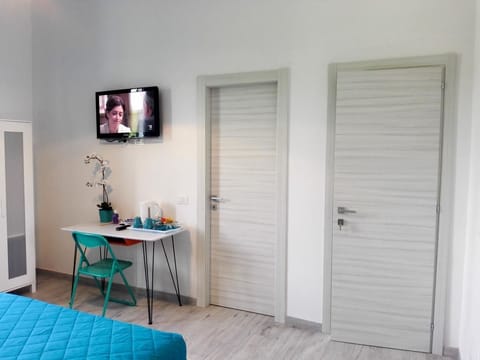 Triple Room, City View | Minibar, desk, blackout drapes, soundproofing