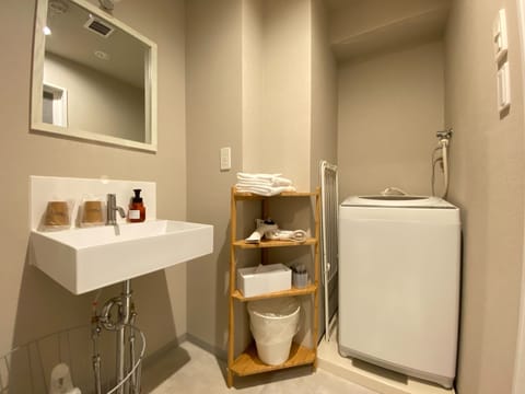 Separate tub and shower, slippers, bidet, towels