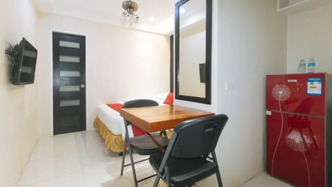 Standard Double Room | Living area | Flat-screen TV