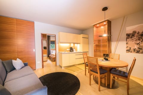 Apartment, Garden View | Living area | 32-inch flat-screen TV with satellite channels