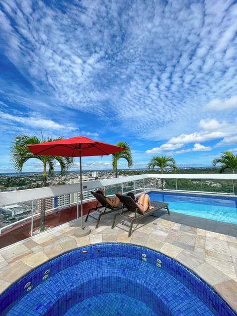 Outdoor pool, pool umbrellas, sun loungers