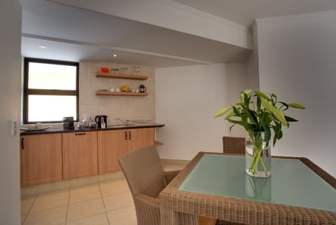 Luxury Suite | Private kitchenette | Fridge, oven, stovetop, coffee/tea maker