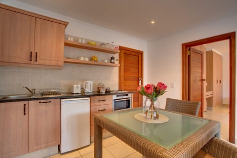 Luxury Suite | Private kitchenette | Fridge, oven, stovetop, coffee/tea maker