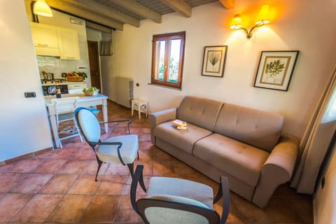 Standard Apartment, 1 Queen Bed | Living area | TV