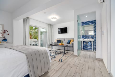 Family Suite, Partial Sea View | Minibar, in-room safe, individually decorated, individually furnished