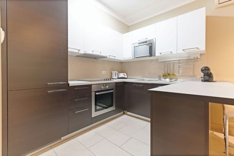 Economy Apartment, Terrace, Ground Floor | Private kitchen | Coffee/tea maker, electric kettle, cleaning supplies