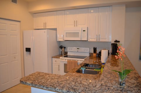 Luxury Condo, Multiple Beds, Non Smoking, Garden View | Private kitchen | Full-size fridge, microwave, oven, stovetop