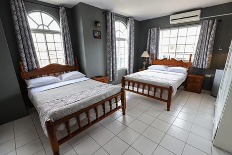 Comfort Quadruple Room, 2 Double Beds, Refrigerator, Garden View | Desk, iron/ironing board, free WiFi, bed sheets